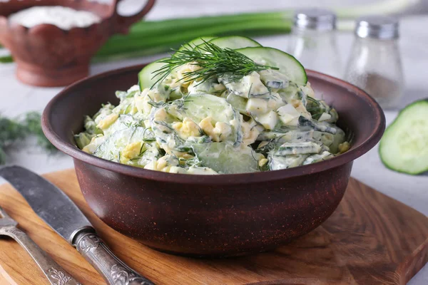 Salad Cucumbers Boiled Eggs Chives Herbs Brown Bowl Wooden Board — Stok fotoğraf