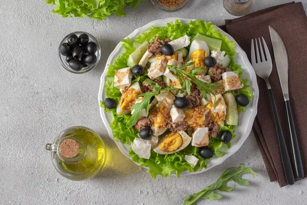 Salad Tuna Cucumber Boiled Eggs Olives Feta Served Green Lettuce — Fotografie, imagine de stoc