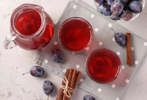 Plum Compote Jug Two Glasses Light Gray Background Top View — Φωτογραφία Αρχείου