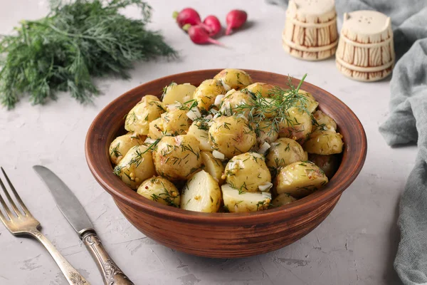 Potato salad with mustard, dill and garlic - traditional German salad for Oktoberfest, New Year and Christmas
