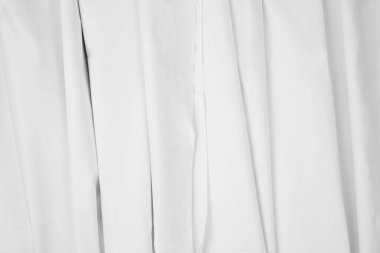 Dalgalı beyaz kumaşlar. İyi tasarlanmış beyaz perde konsepti. Yaratıcı tasarım önizlemesi için tekstil dokusu modeli.