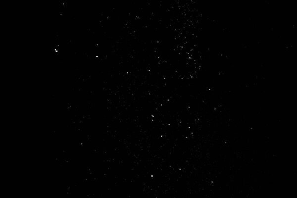 Animation of the white particles on black background representing a snowfall. Snow overlay footage for giving a freezing or winter effect to the video presentation.