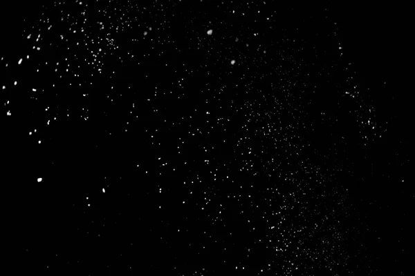 Animation of the white particles on black background representing a snowfall. Snow overlay footage for giving a freezing or winter effect to the video presentation.