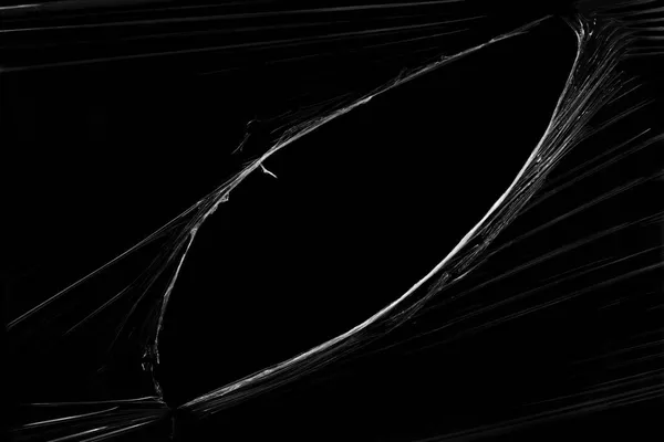 Διαφανή Πλαστική Μεμβράνη Τρύπα Μαύρο Φόντο Ρεαλιστική Σκισμένη Πλαστική Υφή — Φωτογραφία Αρχείου