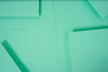 Soyut kağıt arkaplanı yeşille gösterilir. Soyut düzenlemeler duvar kağıtları, posterler, el ilanları vs. için geometrik bir doku oluşturur..