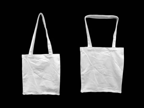 ホワイトトートバッグ孤立黒背景 ショッピングアイテムを持参し モックアップテンプレートを設計するバッグ — ストック写真