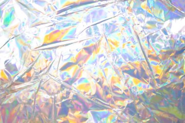 Renkli holografik arka plan. Doku, kapak, duvar kağıdı, baskı vs. için modern Gökkuşağı folyosu. Parlak fütürist bulanık hologram ve soyut eğim renkleri. 