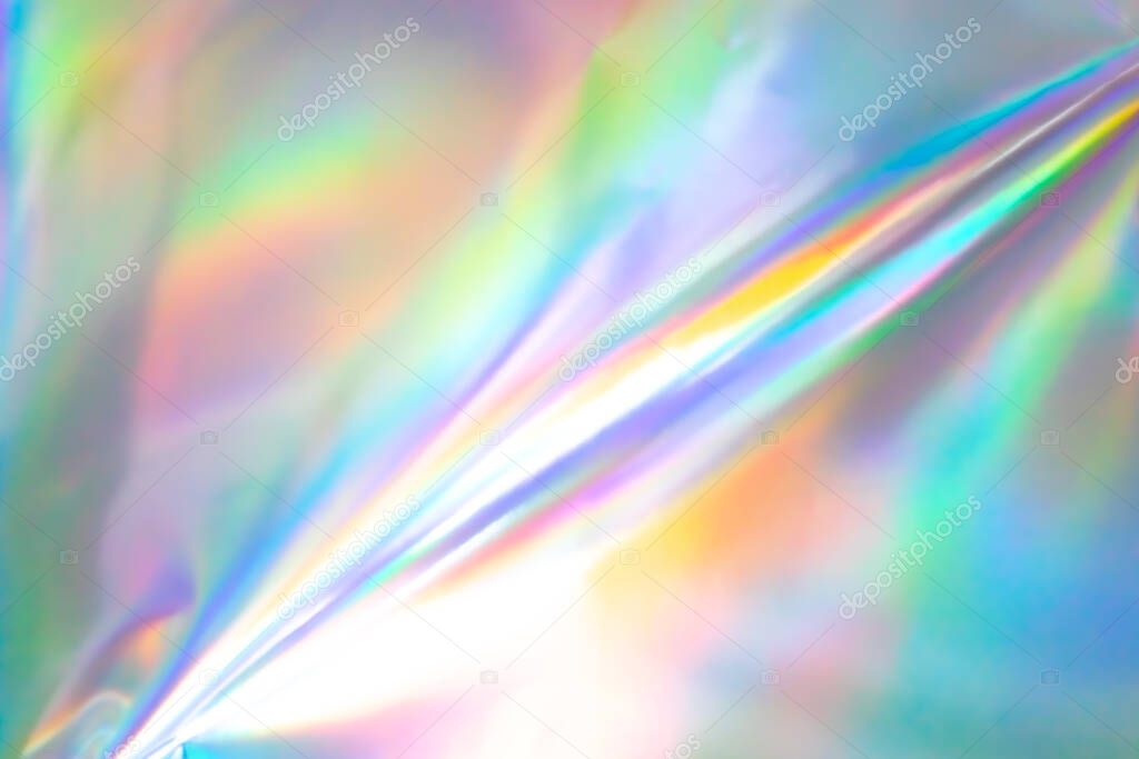 Colorful holographic background. Modern Rainbow foil for Texture, cover, wallpaper, print, etc. Bright futuristic blurred hologram and Abstract gradient colors. 