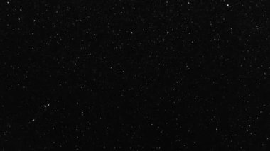 Yıldızlı gece arkaplanında parıldayan yıldız parçacıkları animasyonu. Gökyüzünde parlayan yıldız ışığı. Karanlıkta titreşen parçacıklar.