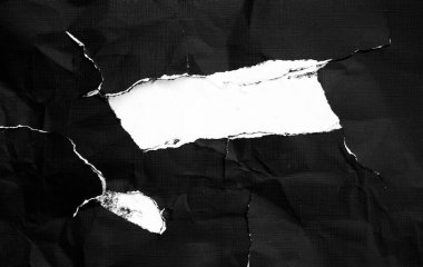 Arka planda beyaz gözyaşları olan siyah bir kağıt. Kirli gözyaşlarıyla buruşmuş kağıt dokusu. 