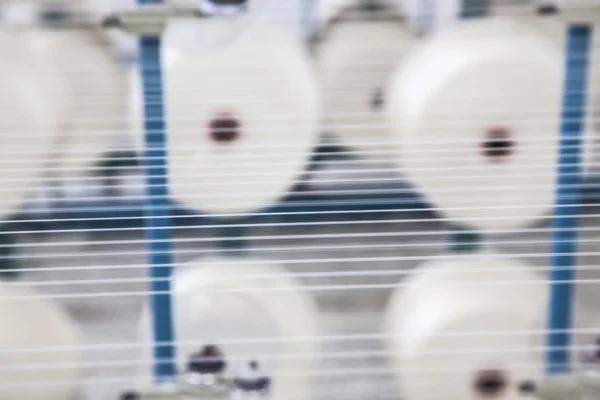Bobinas de algodão empilhadas em racks — Fotografia de Stock