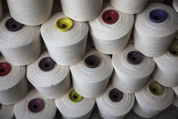 Cotton reels stacked together — Stock Photo, Image