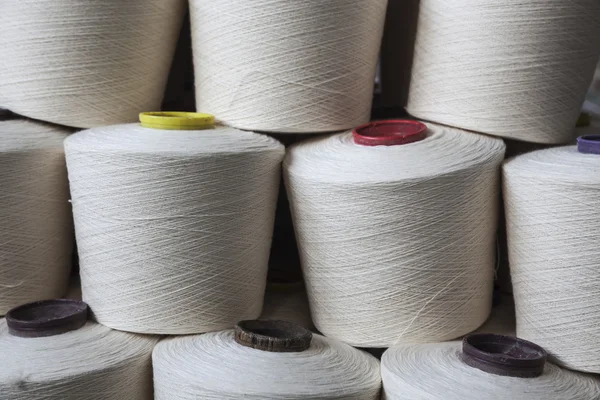 Cotton reels stacked together — Stock Photo, Image