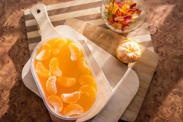 Orange Jelly Plastic Container Tangerine Slices Wooden Planks — Stock Photo, Image