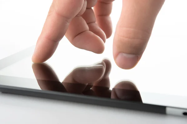 Close view of hand on contemporary tablet pc