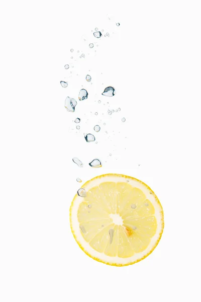 Lemon in water with air bubbles — Stock Photo, Image