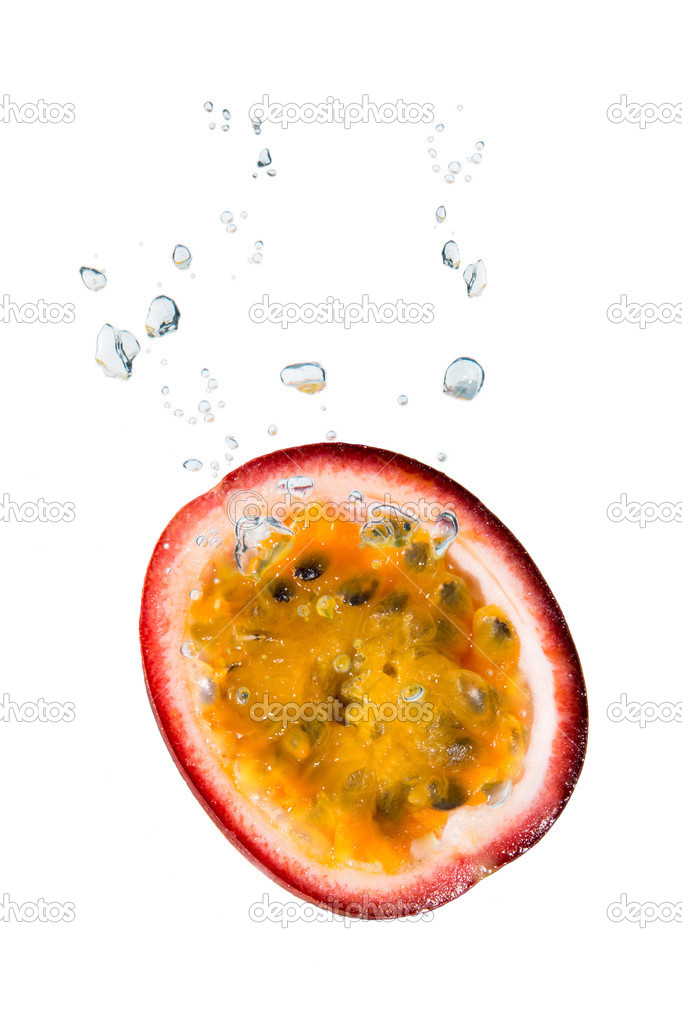 Passion fruit in water with air bubbles