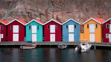 Bay with colorful boathouses and boats in Smoegen on the west coast of Sweden