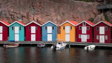 Bay with colorful boathouses and boats in Smoegen on the west coast of Sweden