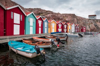 Bay with colorful boathouses and boats in Smoegen on the west coast of Sweden