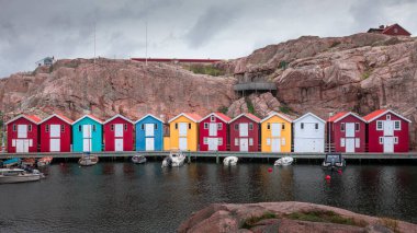 Bay with colorful boathouses and boats in Smoegen on the west coast of Sweden