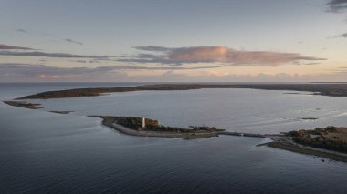 Coast and lighthouse Lange Erik on north coast of the island of Oland in the east of Sweden from above during sunset