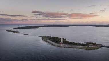 Coast and lighthouse Lange Erik on north coast of the island of Oland in the east of Sweden from above during sunset