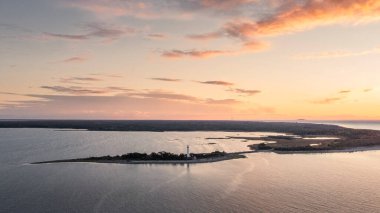 Coast and lighthouse Lange Erik on north coast of the island of Oland in the east of Sweden from above during sunset