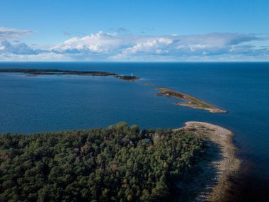 Coast and lighthouse Lange Erik on north coast of the island of Oland in the east of Sweden from above in the sun