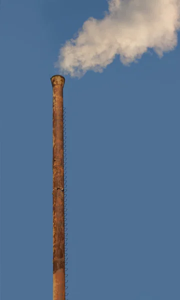 Smoke is coming from a pipe — Stock Photo, Image