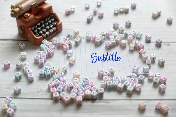 Selective Focus Miniature Typewriter Alphabet Beads Paper Written Subtitle White — Stockfoto