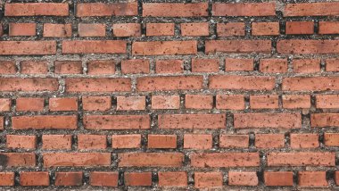 Old texture of red stone brick wall.