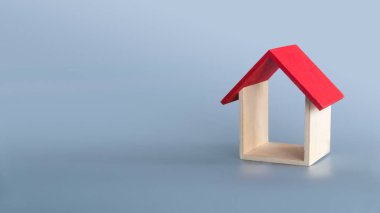 A house model isolated on grey background with copy space.