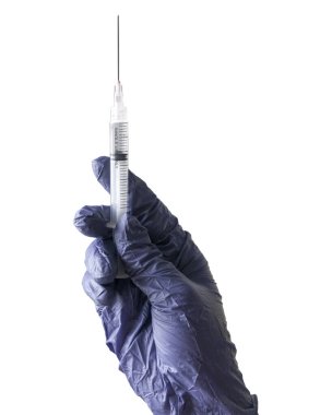 A hand wearing a blue glove holding a syringe isolated on a white background.