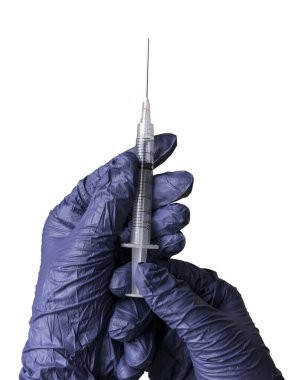 A hand wearing a blue glove holding a syringe isolated on a white background.