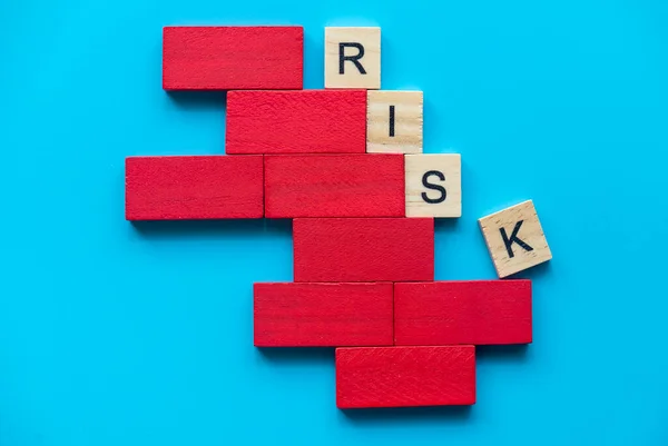 Risk Concept Alphabet Risk Unstable Structure Red Wooden Domino Blue — Fotografia de Stock