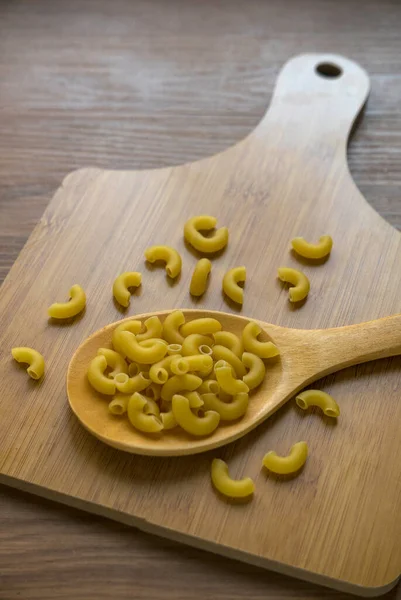 Raw Uncooked Elbow Macaroni Wooden Wooden Spoon — Fotografie, imagine de stoc