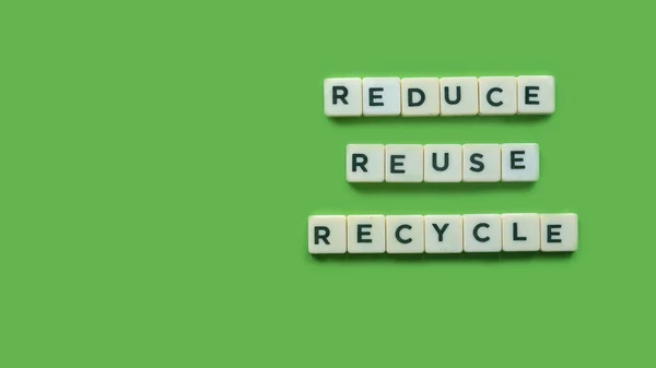 Top View Alphabet Reduce Reuse Recycle Green Background Copy Space — Stock fotografie