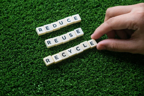 Selective Focus Hand Holding Alphabet Reduce Reuse Recycle Green Grass — Stockfoto