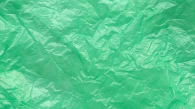 Yeşil ve buruşuk plastik torba arka plan ve doku.