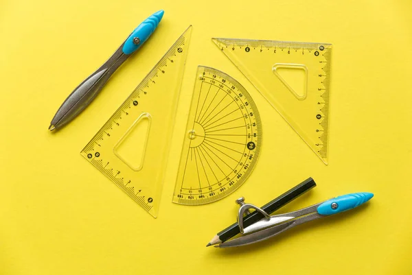 Drawing tools isolated on a yellow background.