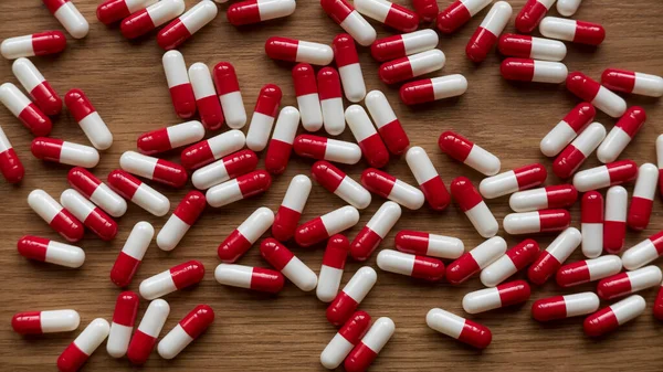 Top View Red White Medicine Pills Capsules Wooden Background — Stockfoto