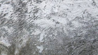 Gri ve beyaz kaba kum taneli taş dokusu arkaplanı.