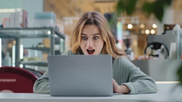 Portrait beautiful young girl student business woman female user winner looking into laptop surprised wide open mouth with delight good news applauds happiness winning opportunity new job notification — 图库视频影像