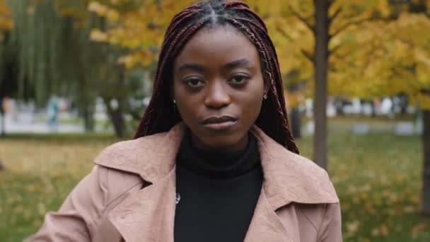 Dissatisfied unhappy african american frowning female client showing thumbs down gesture, negatively evaluating, feeling disappointed with provided service symbol of negative feedback not recommend — Stock videók