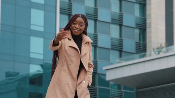 Happy friendly smiling attractive young african american woman business lady manager stretching out waving hand, making hello gesture, welcoming friend partner client at meeting, acquaintance concept — Video