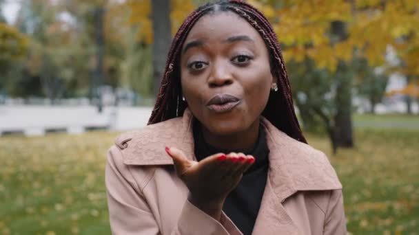 Beautiful happy successful african american woman smile looking at camera make send air kiss millennial girl posing outdoors farewell gesture, flirting demonstrating feelings and love see you concept — Wideo stockowe