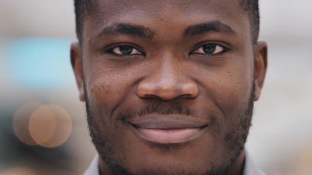 Headshot young happy positive african american businessman company representative looking at camera feeling confident showing perfect healthy toothy smile advertising dental procedure male portrait — 비디오