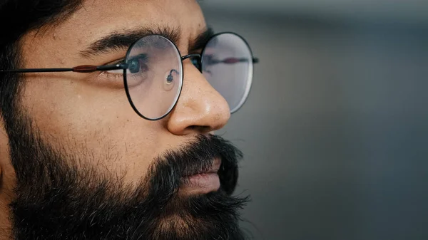 Close up profile face view portrait bearded thoughtful arabian boss entrepreneur business man in glasses indoor dreaming looking away lost in thoughts search ideas self-isolation due covid pandemic — 스톡 사진