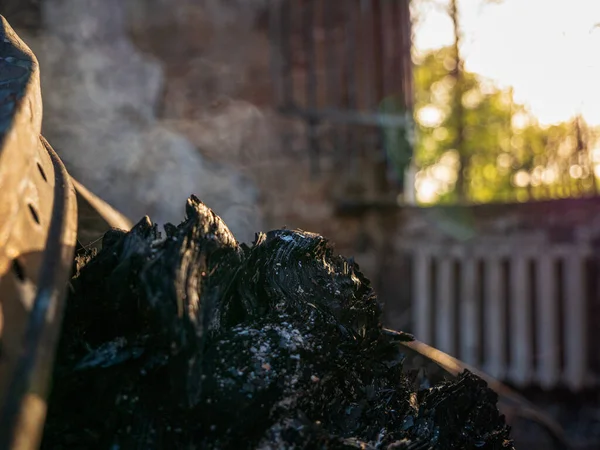 Kharkiv region, Kharkov, Skovorodinovka, Skovorodinivka, Ukraine - 05.07.2022: burning smoldering fire smoking piece of wood fragments destroyed building of museum named Skovoroda missile attack – stockfoto